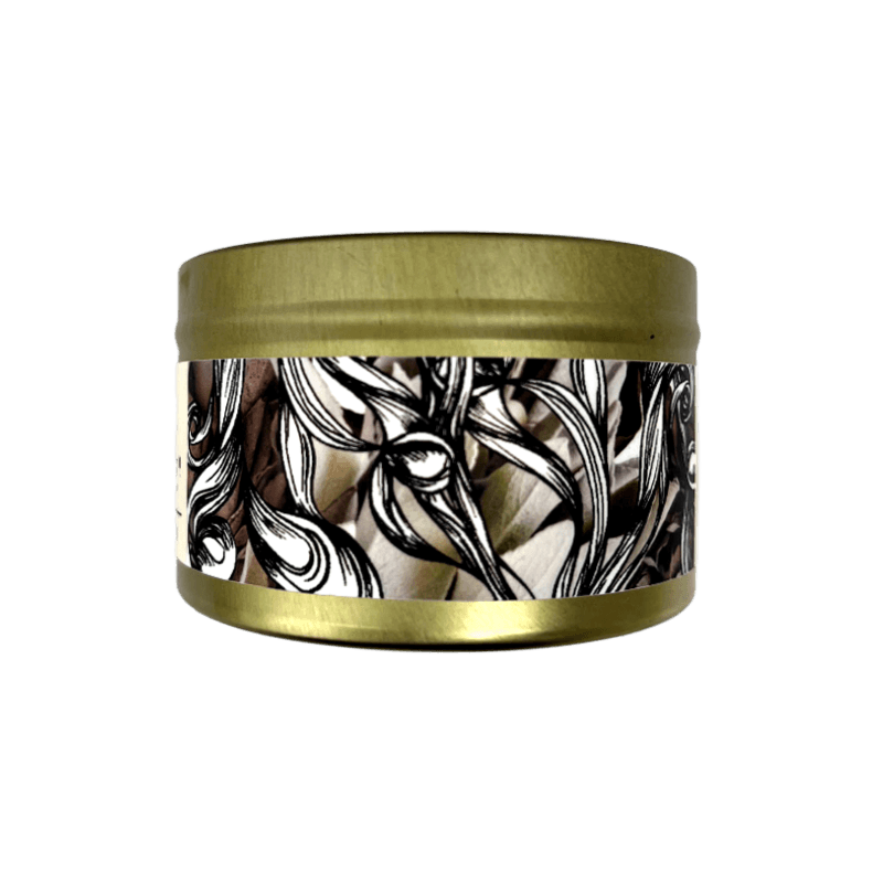 Native Smudge Candle in a gold tin with swirling smoky label design set on a white background