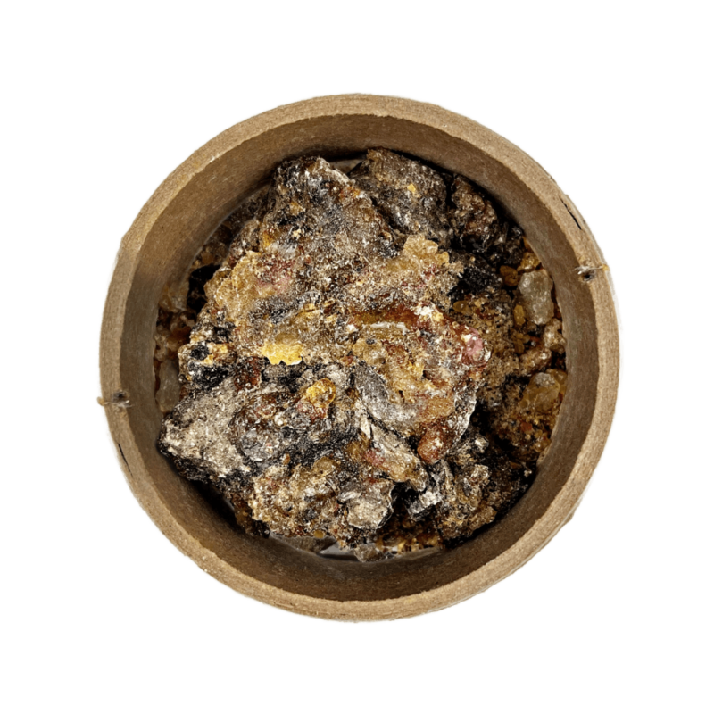 Spruce Resin in a brown bowl set on a white background