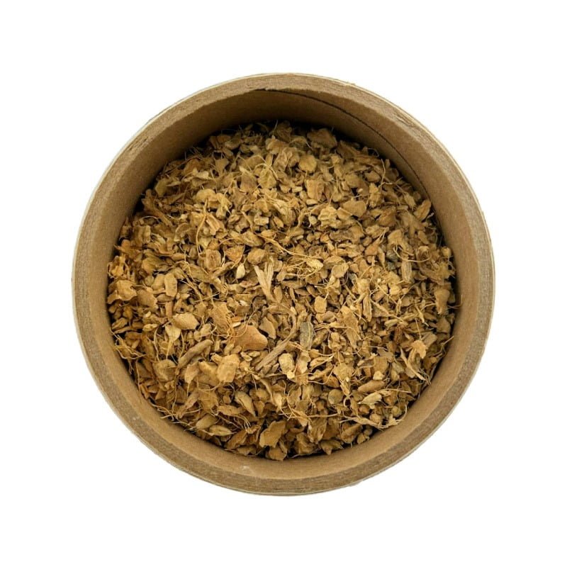 A top-down view of a round cardboard container filled with dried herbs or plant matter, isolated on a white background.