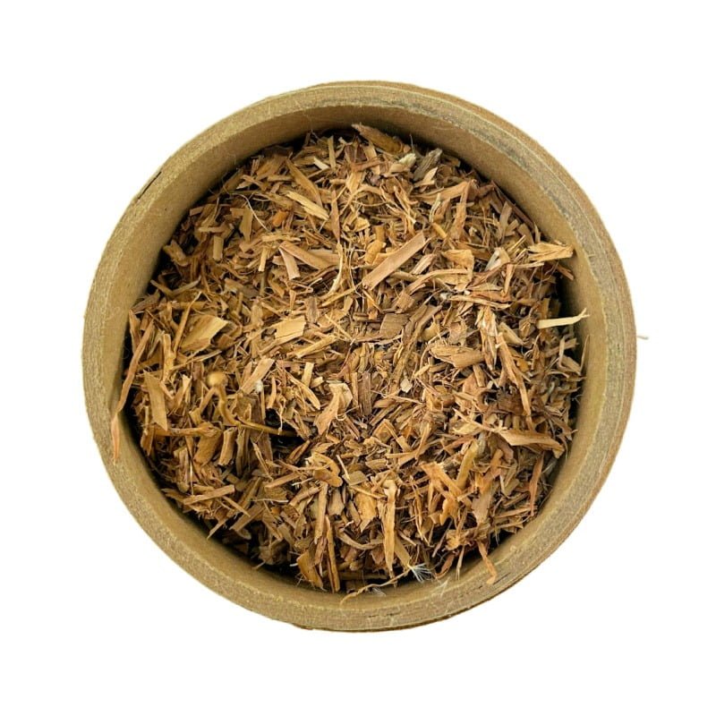 A top view of a round cardboard container filled with white willow bark, against a white background.