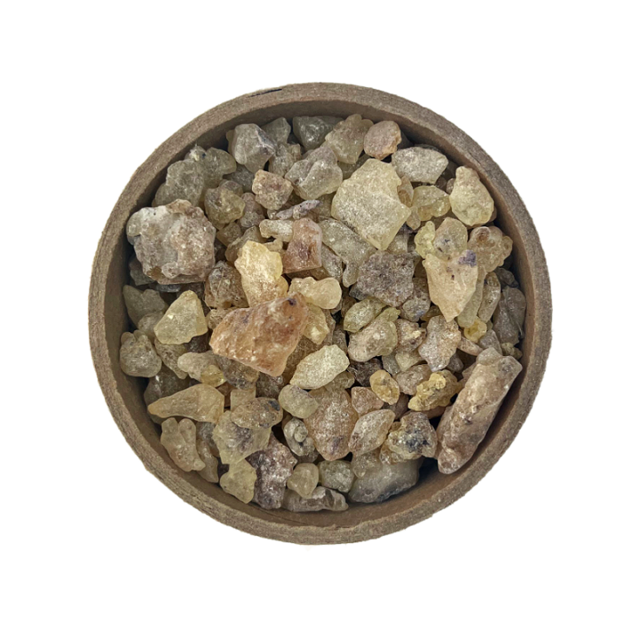 Copal Resin in a brown bowl seti on a white background