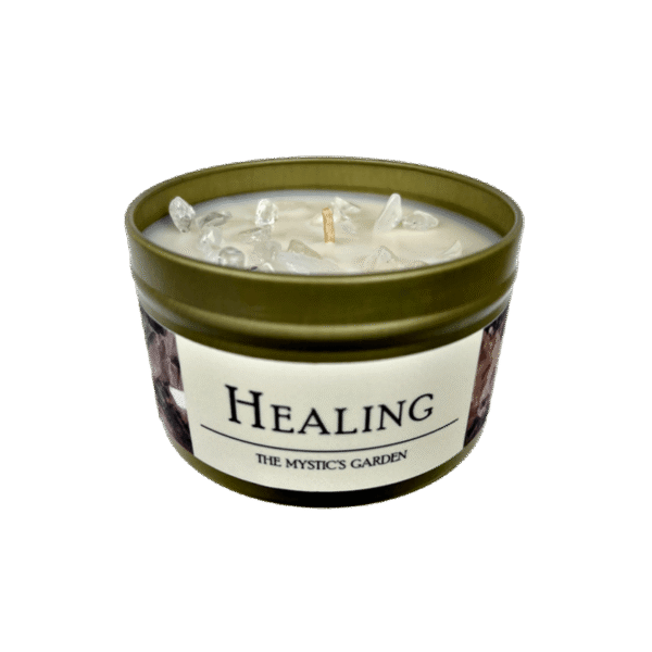 Healing candle in a gold tin with a white label and black text set on a white background