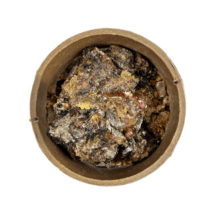 Spruce Resin in a brown bowl set on a white background