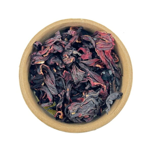 A bowl filled with dried hibiscus petals on a white background.