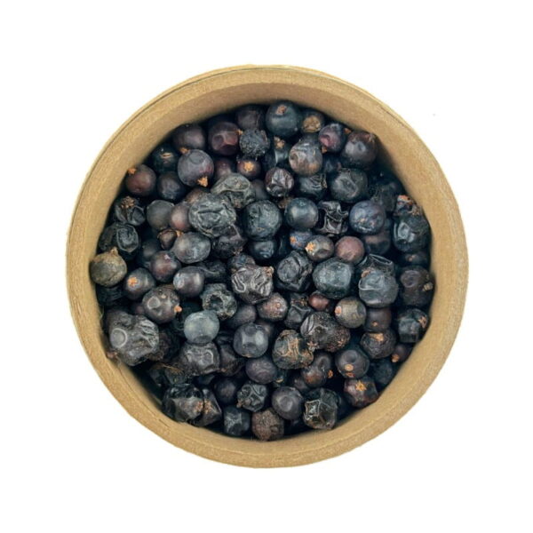 A top view of a round cardboard container filled with dried juniper berries on a white background.