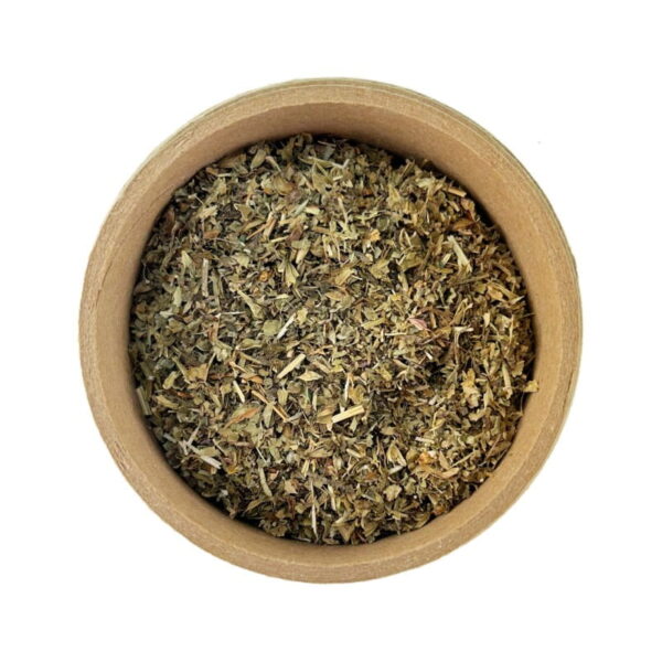 A top-down view of a bowl filled with dried lemon balm herb.
