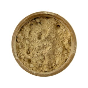 A top view of a round container filled with loose powdered organic maca root isolated on a white background.