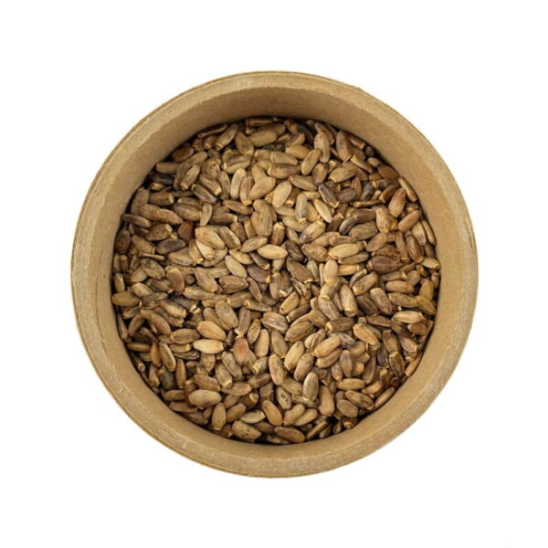 A top view of a round wooden container filled with milk thistle seed on a white background.