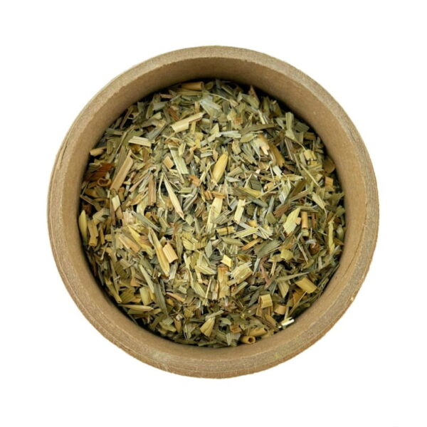 Dried oat straw herb contained in a small, round, brown cardboard container, isolated on a white background.