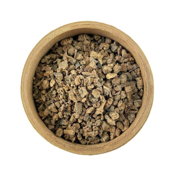 A round wooden bowl filled with dried, valerian root, isolated on a white background.
