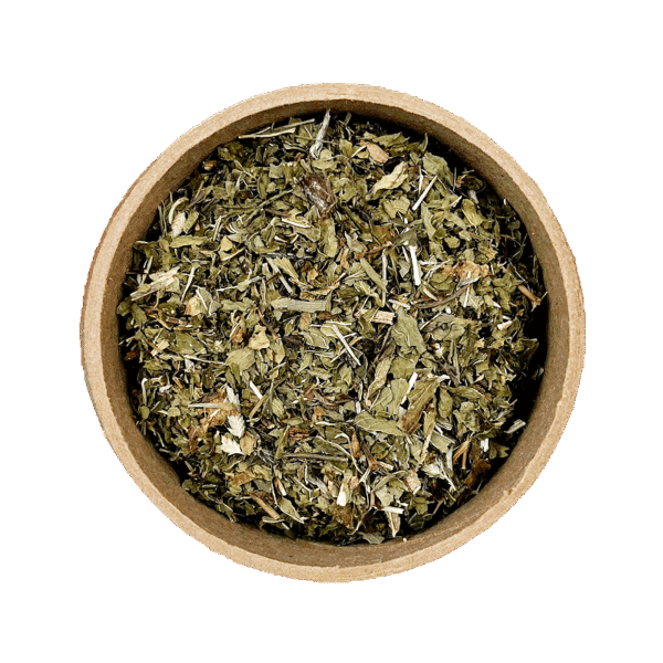 Cut Spearmint leaves in a brown bowl, set against a white background.