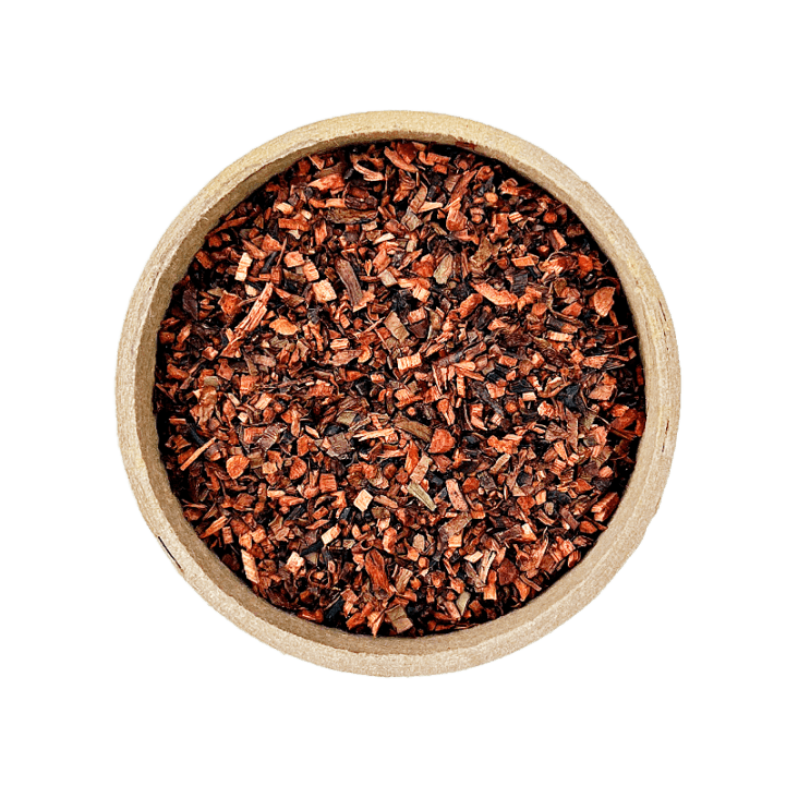Honeybush tea in brown bowl set on a white background